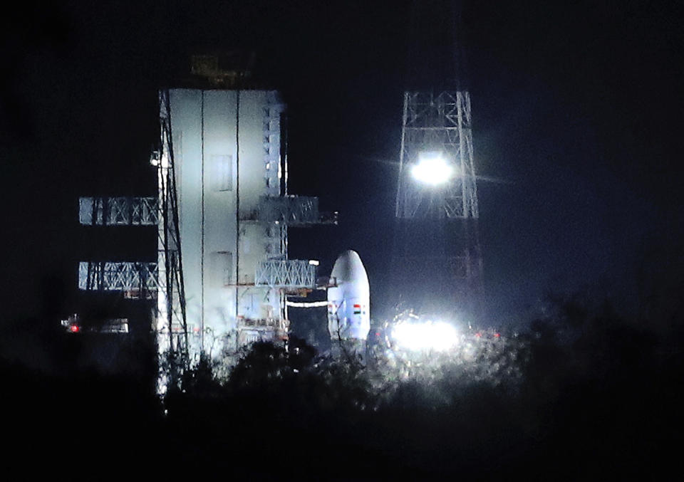 Indian Space Research Organization (ISRO)'s Geosynchronous Satellite launch Vehicle (GSLV) MkIII carrying Chandrayaan-2 stands at Satish Dhawan Space Center after the mission was aborted at the last minute at Sriharikota, in southern India, Monday, July 15, 2019. India has called off the launch of a moon mission to explore the lunar south pole. The Chandrayaan-2 mission was aborted less than an hour before takeoff on Monday. An Indian Space Research Organization spokesman says a "technical snag" was observed in the 640-ton launch-vehicle system. (AP Photo/Manish Swarup)