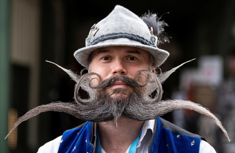 Participant Christian Feicht from Germany poses during the German Moustache and Beard Championships 2021 at Pullman City Western Theme Park in Eging am See, Germany, October 23, 2021. REUTERS/Lukas Barth