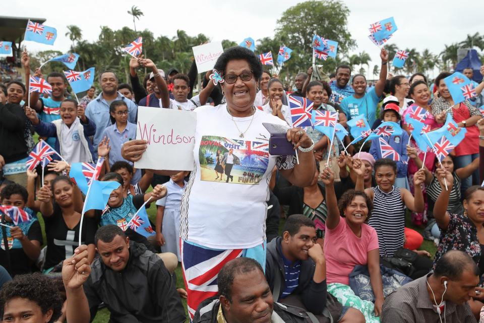 <p><strong>23 October </strong>The locals showed their excitement for the royal visit with signs and flags. </p>