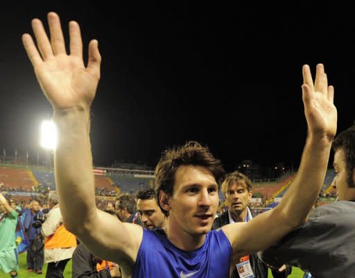 Barcelona's Argentinian forward Lionel Messi celebrates after the Spanish League football match against Levante at Ciutat de Valencia stadium in Valencia. Barcelona were crowned Spanish champions for the third successive season with a 1-1 draw at Levante clinching a 21st domestic title with two games to spare