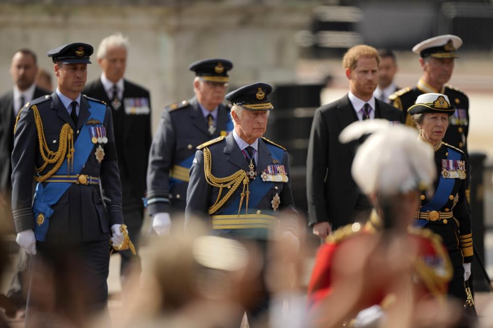 FILE - King Charles III and other members of Royal family follow the coffin of Queen Elizabeth II, during a procession from Buckingham Palace to Westminster Hall in London, Wednesday, Sept. 14, 2022. King Charles III will hope to keep a lid on those tensions when his royally blended family joins as many as 2,800 guests for the new king’s coronation on May 6 at Westminster Abbey. All except Meghan, the Duchess of Sussex, who won’t be attending. (AP Photo/Markus Schreiber, File)