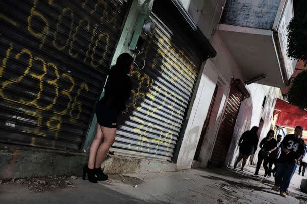 PHOTO: In this Jan. 20, 2019, file photo, a woman pauses in Zona Norte, the Red Light district known for its sex workers, in Tijuana, Mexico. (Spencer Platt/Getty Images, FILE)