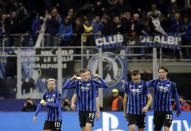 FILE - In this Wednesday, Feb. 19, 2020 file photo, Atalanta's Josip Ilicic, second left, celebrates with teammates after scoring his side's second goal during the Champions League round of 16, first leg, soccer match between Atalanta and Valencia at the San Siro stadium in Milan, Italy. It was the biggest soccer game in Atalanta’s history and a third of Bergamo’s population made the short trip to Milan’s famed San Siro Stadium to witness it. Nearly 2,500 fans of visiting Spanish club Valencia also traveled to the Champions League match. More than a month later, experts are pointing to the Feb. 19 game as one of the biggest reasons why Bergamo has become one of the epicenters of the coronavirus pandemic — a “biological bomb” was the way one respiratory specialist put it — and why 35% of Valencia’s team became infected. The new coronavirus causes mild or moderate symptoms for most people, but for some, especially older adults and people with existing health problems, it can cause more severe illness or death. (AP Photo/Luca Bruno, File)