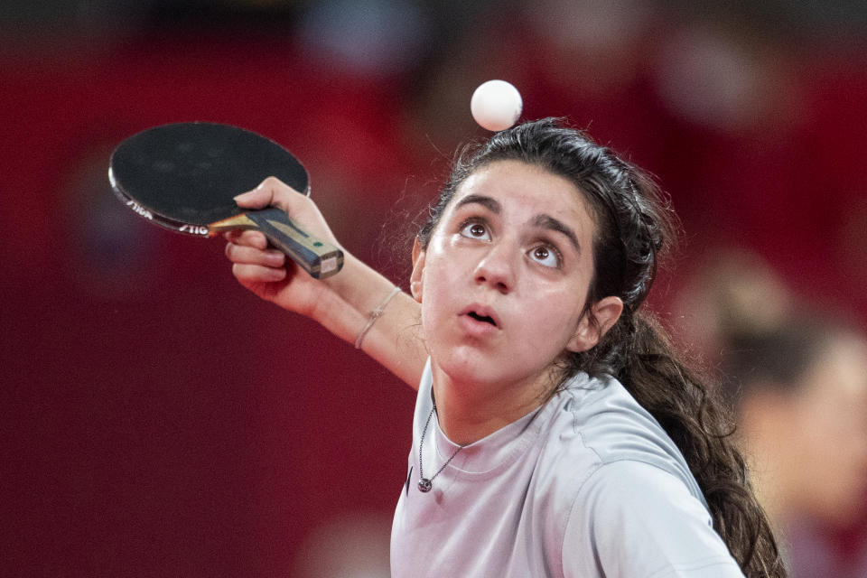 TOKYO, JAPAN - JULY 24: Twelve year old Hend Zaza of Syria, the youngest competitor in the Olympic Games in Tokyo, in action against  Jia Liu of Austria in the Women's Singles  Preliminary Round in the Tokyo Metropolitan Gymnasium at the Tokyo 2020 Summer Olympic Games  on July 24, 2021 in Tokyo, Japan. (Photo by Tim Clayton/Corbis via Getty Images)