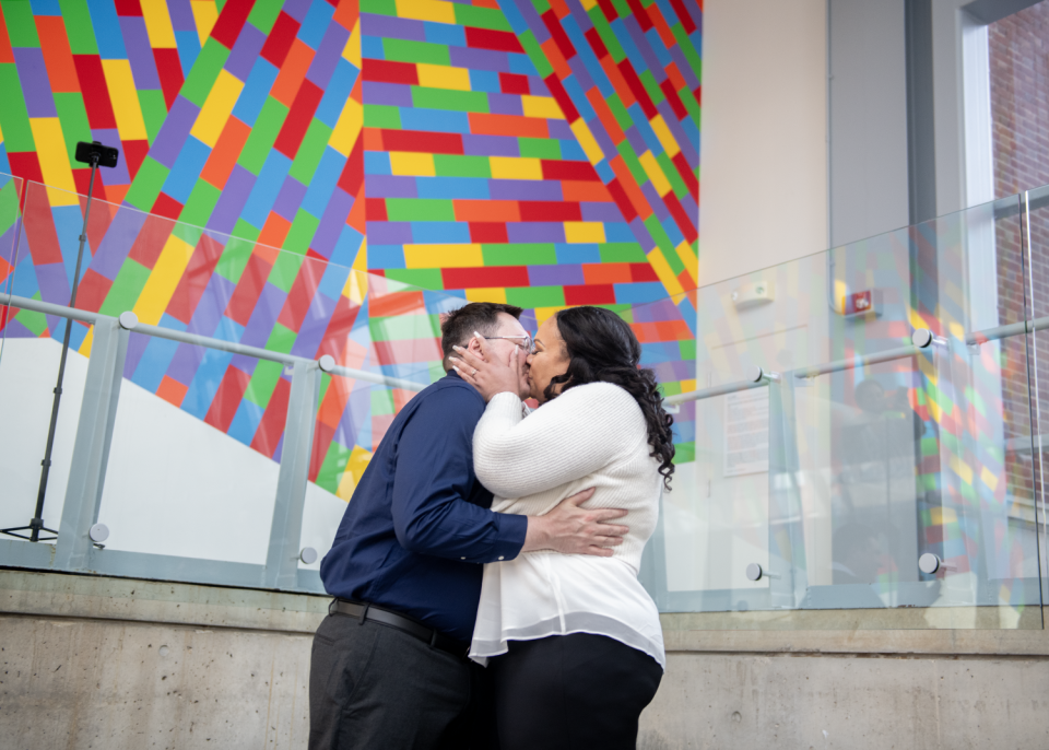 Ronald Gould and Shayla Freeman share a wedding kiss Thursday as part of special leap day nuptials performed by Judge Ron Cable at the Akron Art Museum.
