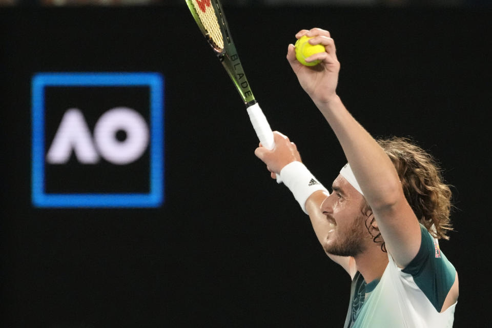 Stefanos Tsitsipas of Greece celebrates after defeating Taylor Fritz of the U.S. in their fourth round match at the Australian Open tennis championships in Melbourne, Australia, early Tuesday, Jan. 25, 2022. (AP Photo/Simon Baker)