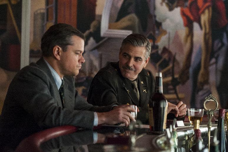 This image released by Columbia Pictures shows Matt Damon, left, and George Clooney in "The Monuments Men." (AP Photo/Columbia Pictures, Claudette Barius)