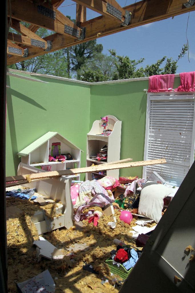 This Tuesday, April 29, 2014 photo shows the roof from a child's bedroom in the home of Mike Skinner, of Decatur, Miss., that was blown away from a tornado. Several homes were damaged and the Country Club across the street had significant damage to 140 golf sheds and trees downed on the golf course. (AP Photo/The Meridian Star, Paula Merritt)