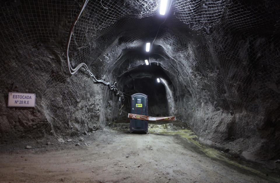 In this Sept. 25, 2012 photo, a portable toilet sits in an old inspection tunnel under the Chuquicamata copper mine in the Atacama desert in northern Chile. Experts say that by 2019 the Chuquicamata copper mine will be unprofitable, so state-owned mining company Codelco is trying to head off closure by converting the open pit into the world's largest underground mine. Codelco believes the mine still has much more to give, with reserves equal to about 60 percent of all the copper exploited in the mine's history still buried deep beneath the crater. (AP Photo/Jorge Saenz)