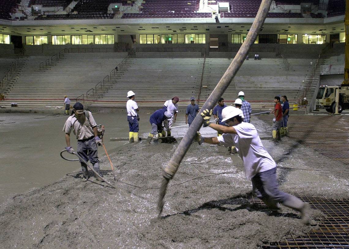 Concrete is poured for the event floor in the new Carolina Center in September 2002.