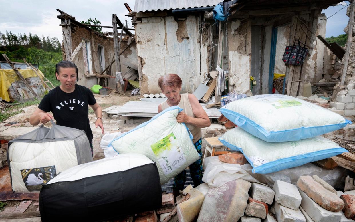 Residents of Bohorodychne are totally reliant on aid as every house is smashed and those who have returned use a UN tarpaulin to keep the water out