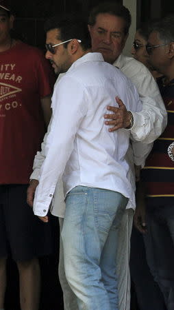 Bollywood actor Salman Khan (L) is embraced by his father Salim Khan as he leaves his house for court in Mumbai, Maharashtra May 6, 2015. REUTERS/Stringer