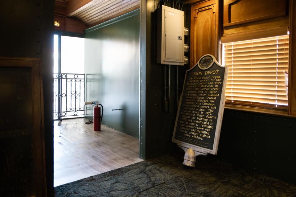 A Michigan historic site sign leans against a wall inside the vintage Pullman sleeper railcar that will serve as a dining area for patrons of Bobcat Bonnie's Tuesday, Jan. 16, 2024.