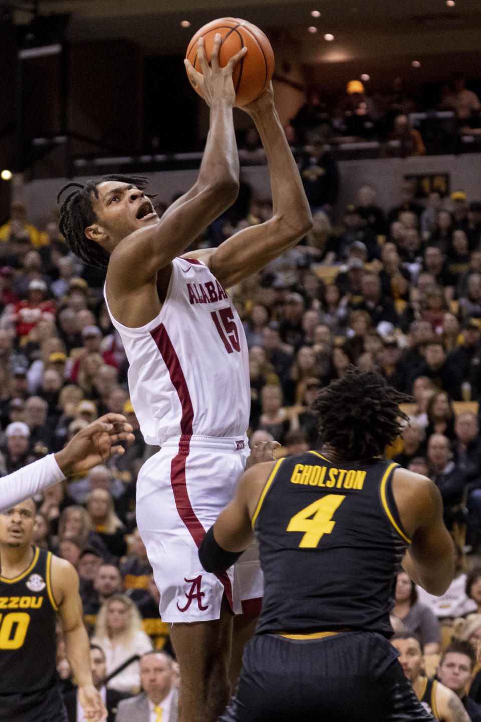 Alabama's Noah Clowney shoots over Missouri's DeAndre Gholston during the first half of an NCAA college basketball game Saturday, Jan. 21, 2023, in Columbia, Mo. (AP Photo/L.G. Patterson)