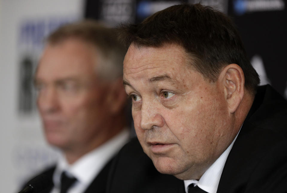 New Zealand All Blacks coach Steve Hansen, right, and selector Grant Fox answer questions during a press conference at the Prebbleton Rugby Club on the outskirts of Christchurch, New Zealand, Monday, Oct. 15, 2018. The All Blacks have taken the unprecedented step of naming a player based in Japan among an enlarged 51-man squad for autumn test matches against Australia, Japan, England, Ireland and Italy. (AP Photo/Mark Baker)