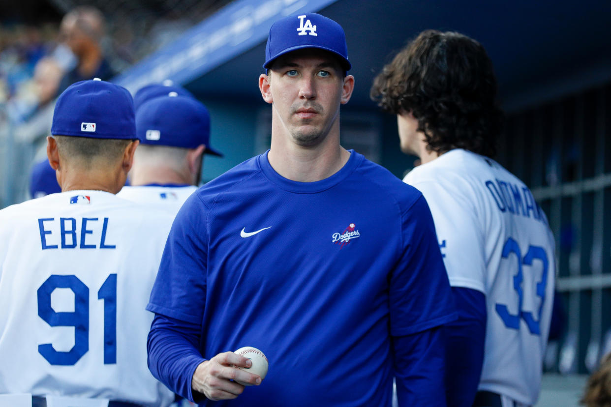 LOS ANGELES, CA - MAY 16: Los Angeles Dodgers pitcher Walker Buehler (21) walks in the dugout prior to a regular season game between the Minnesota Twins and Los Angeles Dodgers on May 16, 2023 at Dodger Stadium in Los Angeles, CA. (Photo by Brandon Sloter/Icon Sportswire via Getty Images)