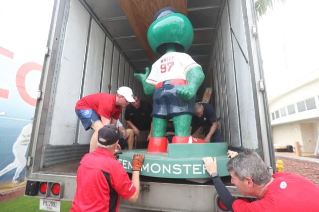 BOSTON, MA - FEBRUARY 03: Boston Red Sox mascot, Tessie the Green Monster,  tosses soft baseballs to fans while on a flatbed truck ahead of the spring  training equipment truck as it departs on Boston Red Sox Truck Day on  February 3, 2023, at Fenway