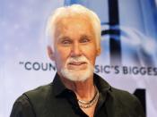 FILE PHOTO: Kenny Rogers poses backstage after accepting the Willie Nelson Lifetime Achievement award at the 47th Country Music Association Awards in Nashville