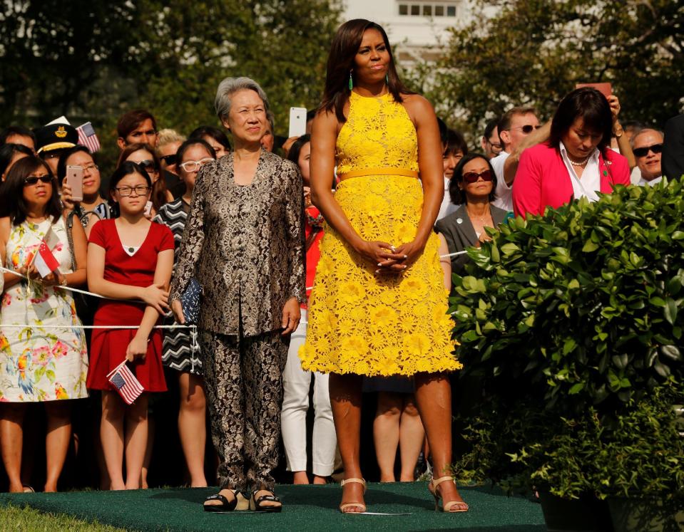 Michelle Obama and Ho Ching stand together during an official arrival ceremony on the South Lawn of the White House in Washington, U.S.