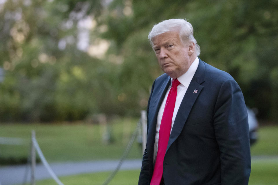 FILE- In this Thursday, June 25, 2020, file photo, President Donald Trump walks on the South Lawn after arriving on Marine One at the White House in Washington. The president's brother Robert Trump has filed a second court action seeking to halt publication of a tell-all book by the president's niece, after his first bid was rejected by a New York City judge. (AP Photo/Alex Brandon, File)