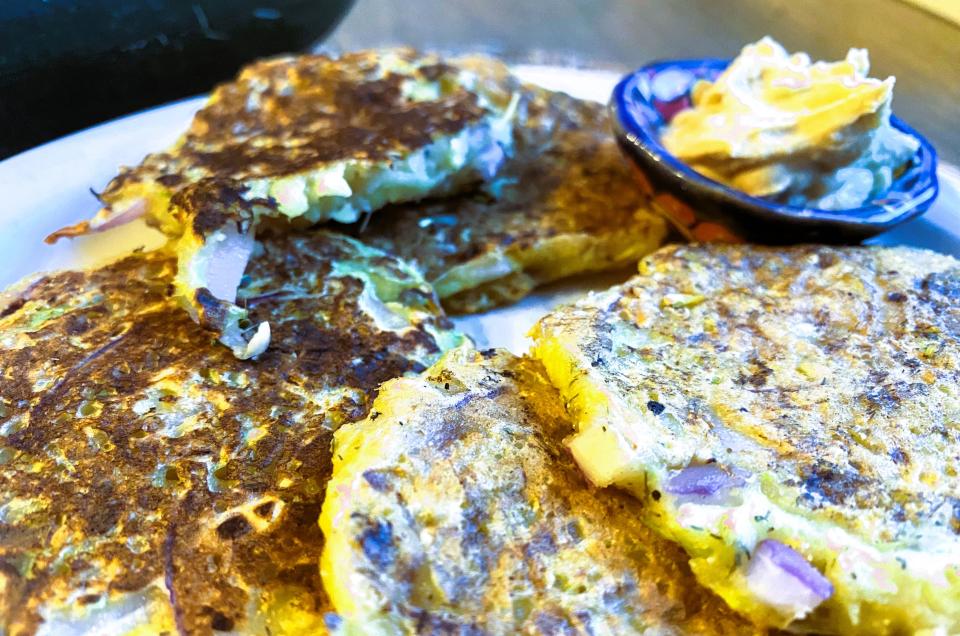 When making zucchini fritters with young, smaller zucchinis, the skin will be tender and the seeds small, so no need to peel or seed the squash before grating.