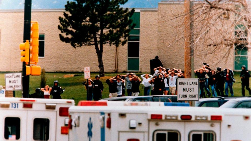 PHOTO: Students run from Columbine High School under cover from police during a shooting at the school in Littleton, Colorado, Apr. 20, 1999. (Steven D. Starr/Corbis via Getty Images)
