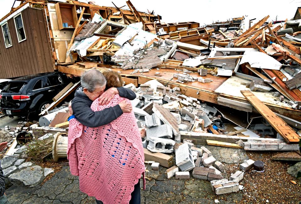 Bill and Shirley Wallace tearfully hug as they return to the house where they were trapped when it fell on them during the tornado in Mt. Juliet on Wednesday, March 4, 2020. They escaped with the help of neighbors from the small hole in the rubble just to the right of where they are standing. "There was a higher being than us with us the whole time," Bill Wallace said.