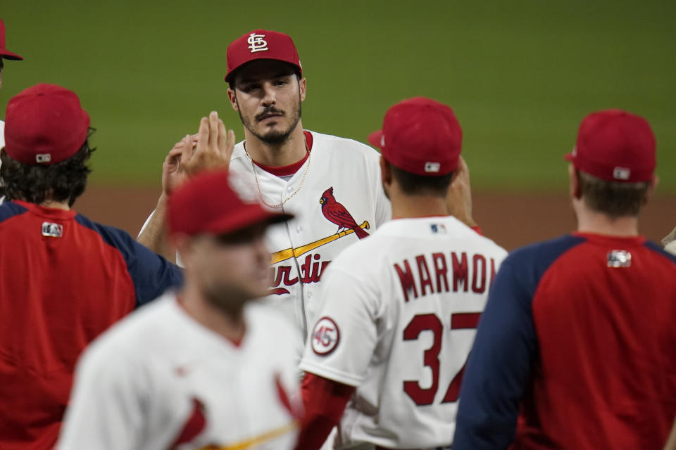 St. Louis Cardinals' Nolan Arenado celebrates a 5-2 victory over the Pittsburgh Pirates in a baseball game Tuesday, May 18, 2021, in St. Louis. (AP Photo/Jeff Roberson)