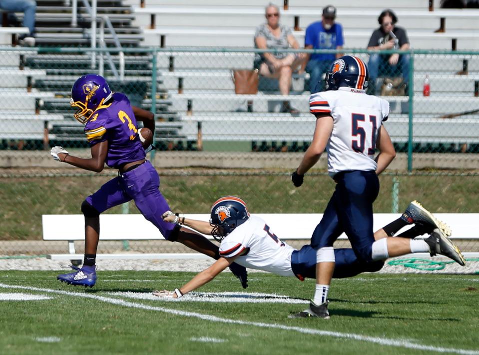 South Bend Clay sophomore Tyrese Jones (3) avoids a tackle from a North Newton defender on his way to a touchdown in the second quarter of a football game Saturday, Sept. 30, 2023, at Clay Middle School in South Bend.