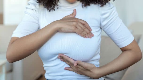 STOCK PHOTO: A woman palpats her breast (STOCK PHOTO/Getty Images)