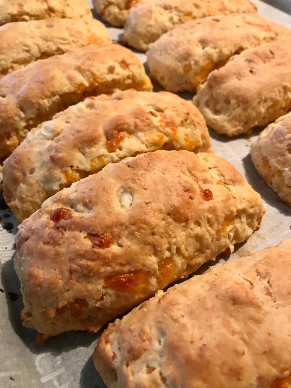 Cheddar and green onion scones from "Baking With Dorie" are cut into a bar shape.