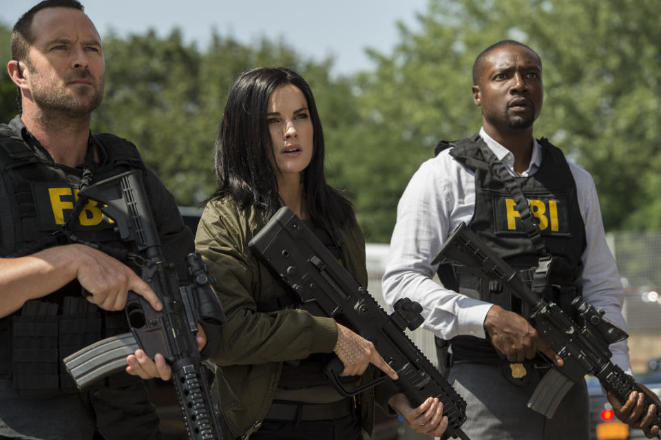 Jaimie Alexander, doing what she does as Jane Doe in NBC’s <em>Blindspot,</em> alongside Sullivan Stapleton as Kurt Weller and Rob Brown as Edgar Reade. The show’s fall finale airs on Friday, Dec. 22. (Photo: David Giesbrecht/NBC/Warner Bros/NBCU Photo Bank)