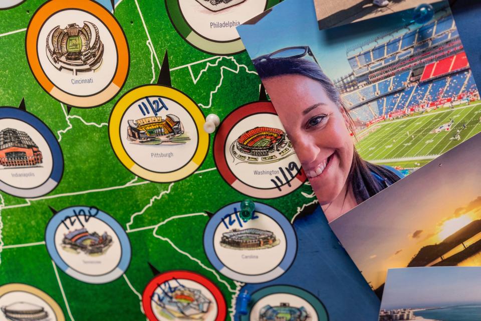 A photo of Detroit Lions superfan Megan "Yoopergirl" Stefanski and a poster marking some of the NFL football stadiums she has visited hangs on a wall in her office at the DeTour Public Library, where she works as a school librarian, on Wednesday, Aug. 30, 2023.