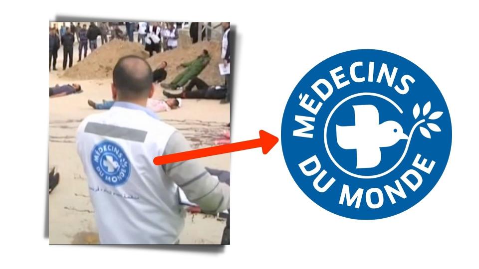 <div class="paragraphs"><p>The logo for French Charity <em>Médecins du Monde </em>or Doctors of the World is seen on people's backs.</p></div>