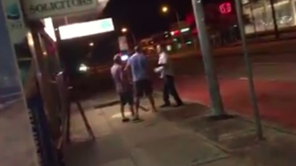 A man can be seen separating the men during the altercation. Photo: Facebook