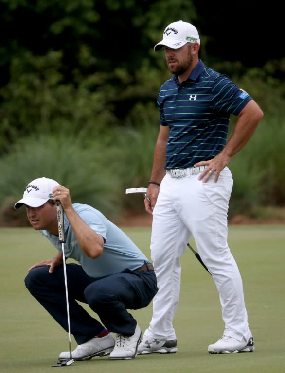 Kevin Kisner and Scott Brown line up a putt during the third round of the Zurich Classic, at TPC Louisiana in Avondale, on April 29, 2017