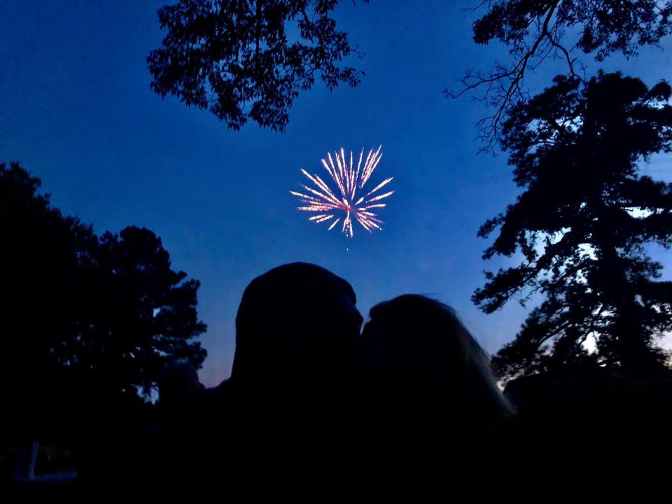 "Virginia is for Lovers"... a couple kisses while viewing fireworks in Chesterfield County, Va. in 2020.