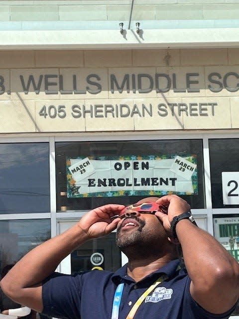 Troy Mangum, a teacher at Ida B. Wells Middle School in Washington, D.C., took his students outside April 8, 2024 to view the solar eclipse. "Anytime we can get hands on or dynamic learning…it’s invaluable,’’ Mangum said.