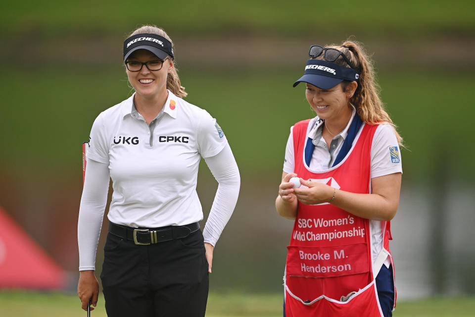 Brooke Henderson interacts with her caddie on the eighth green during Day Four of the HSBC Women’s World Championship at Sentosa Golf Club on March 03, 2024 in Singapore. (Photo by Ross Kinnaird/Getty Images)