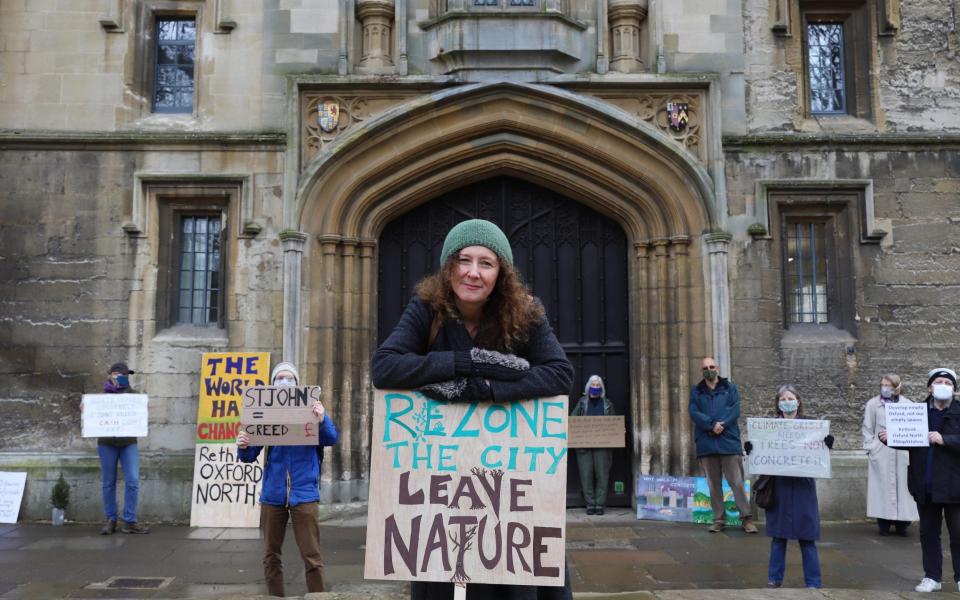 Dr Carol Peaker among the protestors outside St John's College in Oxford, which is developing land north of the city - John Lawrence for The Telegraph