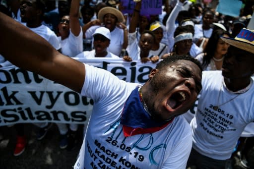 Demonstrators shout slogans during a protest against sexual violence in Port-au-Prince, Haiti on May 26, 2019