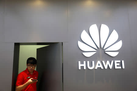 A staff uses a phone as he works at Huawei Flagship Store in Bangkok, Thailand May 23, 2019. REUTERS/Soe Zeya Tun