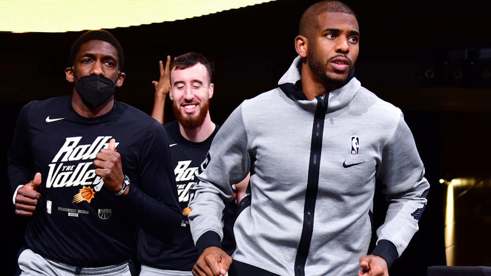 Chris Paul and Phoenix Suns teammates, pictured here before a game against the Denver Nuggets.