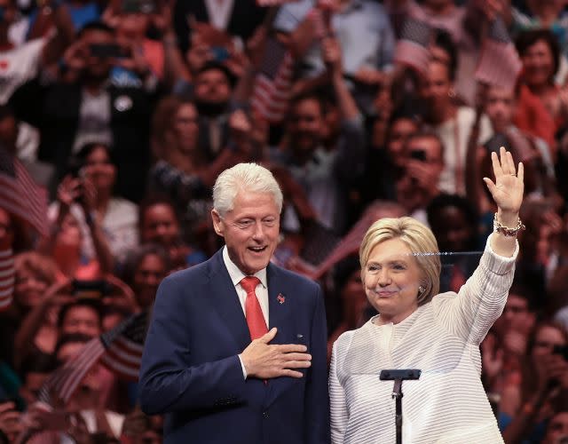 NEW YORK, NY – JUNE 7: (L to R) Husband and former president Bill Clinton and Democratic presidential candidate Hillary Clinton acknowledge the crowd during a primary night rally at the Duggal Greenhouse in the Brooklyn Navy Yard, June 7, 2016 in the Brooklyn borough of New York City. Clinton has secured enough delegates and commitments from superdelegates to become the Democratic Party’s presumptive presidential nominee. She will become the first woman in U.S. history to secure the presidential nomination of one of the country’s two major political parties. (Photo by Drew Angerer/Getty Images)