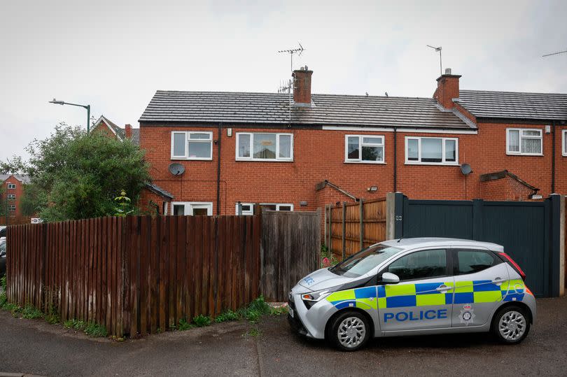 A police car outside a house