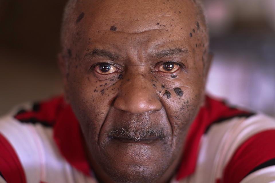 Michael Williams sits for a portrait in his South Side Chicago home Tuesday, July 27, 2021. Williams was behind bars for nearly a year before a judge dismissed the murder case against him in July at the request of prosecutors, who said they had insufficient evidence. (AP Photo/Charles Rex Arbogast)