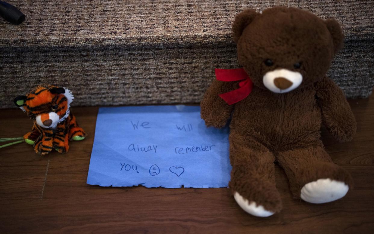 Stuffed animals are left at the altar during a prayer vigil for 10-year-old Iliana "Lily" Peters at Valley Vineyard Church in Chippewa Falls on Monday night.