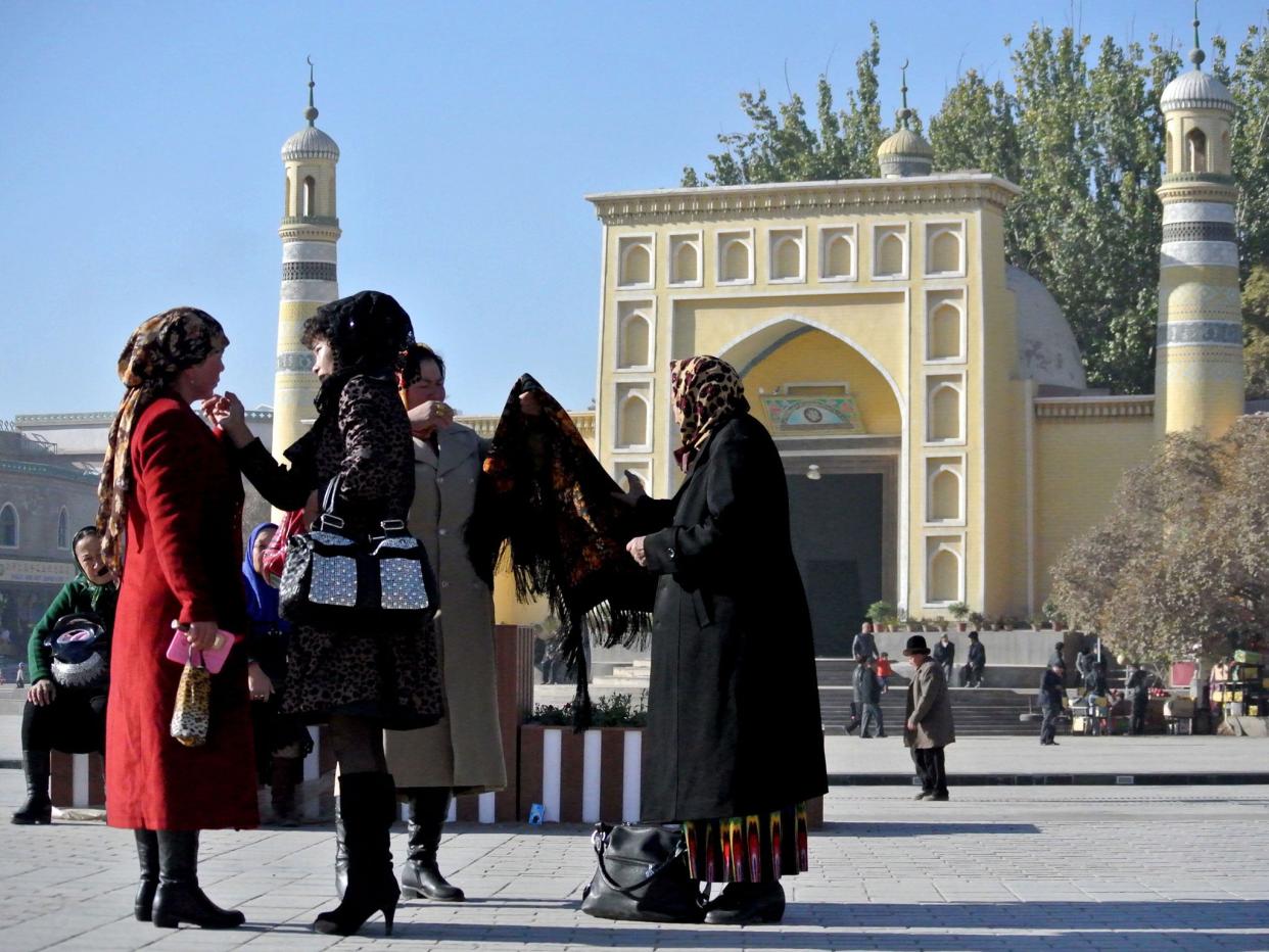 A group of Uighur women outside a mosque in Kashgar, farwest China's Xinjiang region, November 2013 (AFP/Getty Images)