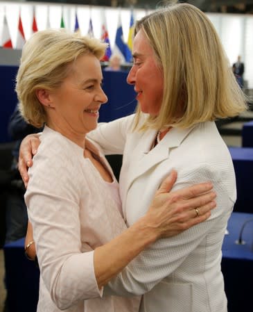 Elected European Commission President Ursula von der Leyen is congratulated by European Union High Representative for Foreign Affairs and Security Policy Federica Mogherini after a vote on her election at the European Parliament in Strasbourg