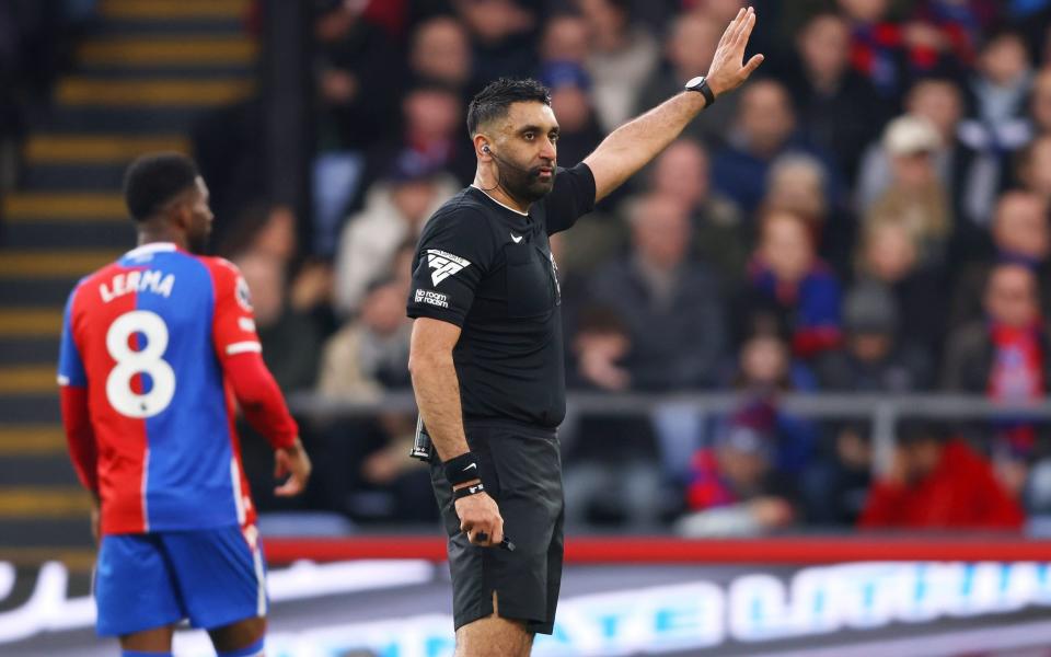 Referee Sunny Singh Gill gestures during the Premier League match between Crystal Palace and Luton Town at Selhurst Park